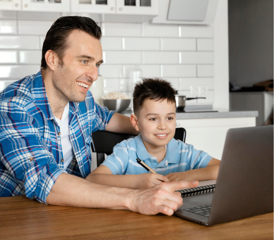 dad with his 3rd grader son solving math with a laptop on table