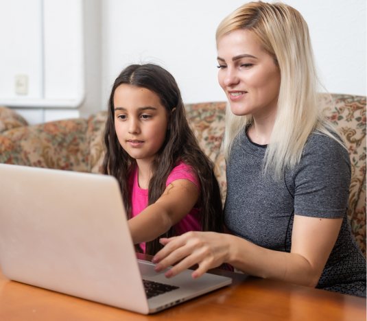 female tutor and girl studying with laptop on a table